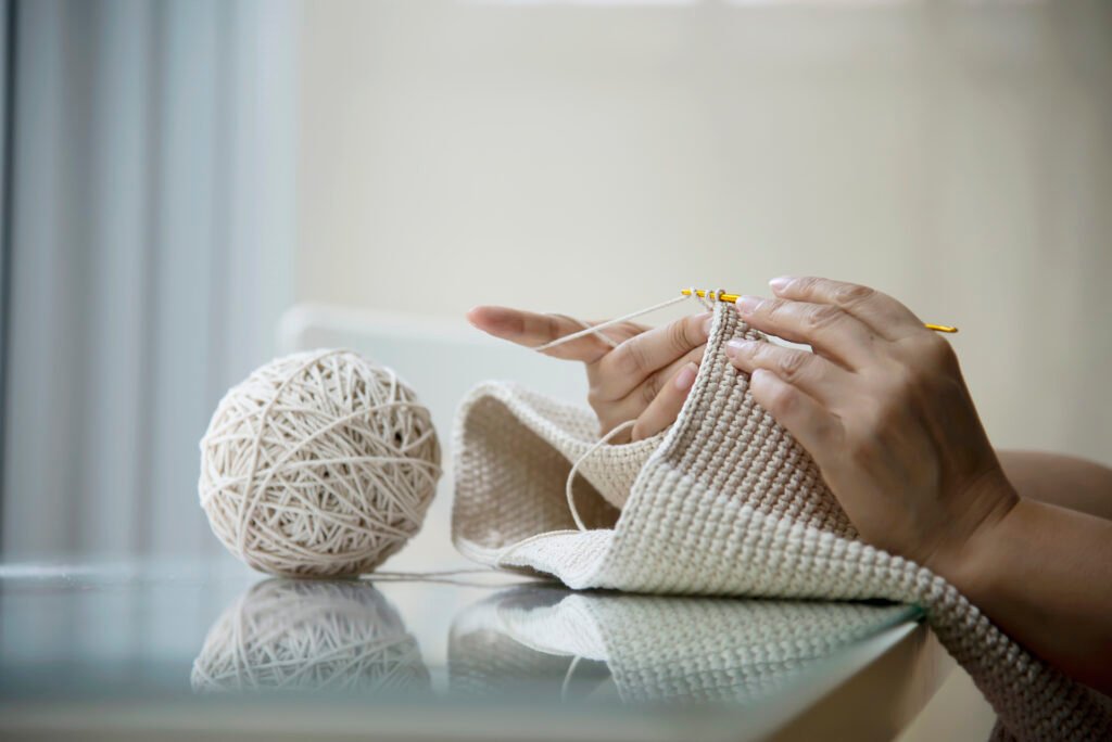 woman knitting at home