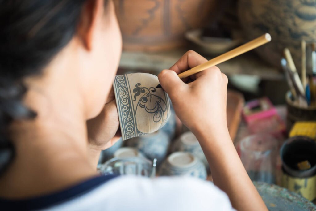 Woman Made Painting On Ceramic Cup